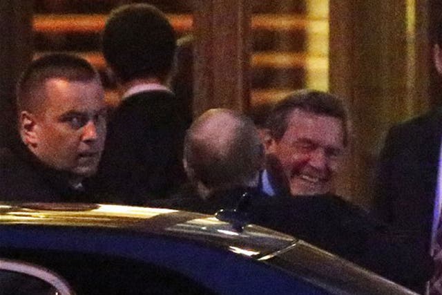 Putin and Schroeder embrace in pictures reportedly taken at a 70th birthday party 