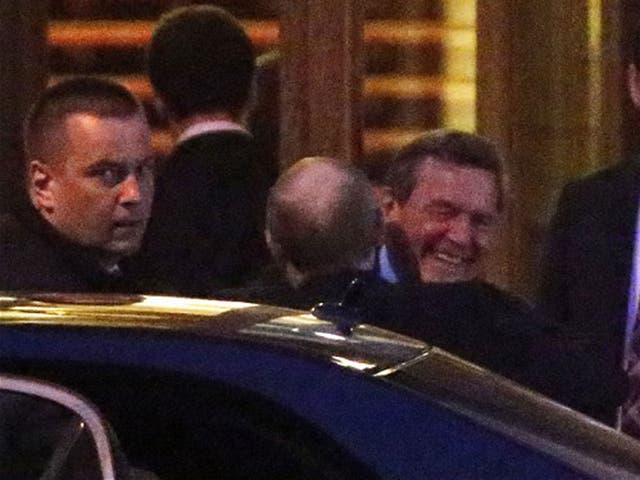 Putin and Schroeder embrace in pictures reportedly taken at a 70th birthday party 