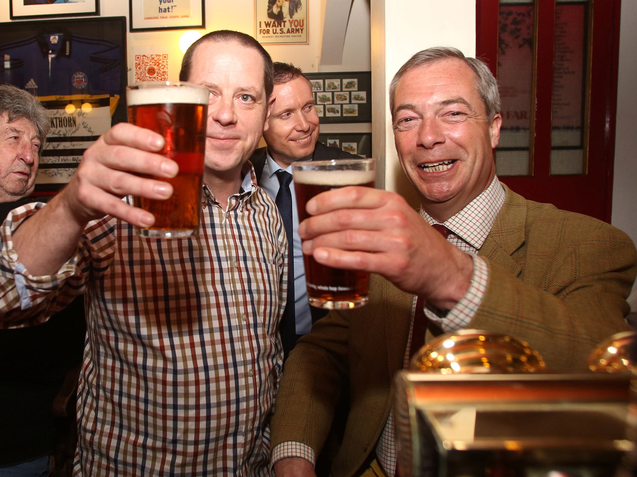 Ukip leader Nigel Farage enjoys a pint with Paul Alvis, the landlord of Volunteer Rifleman's Arms, as he visits Bath to meet with party members