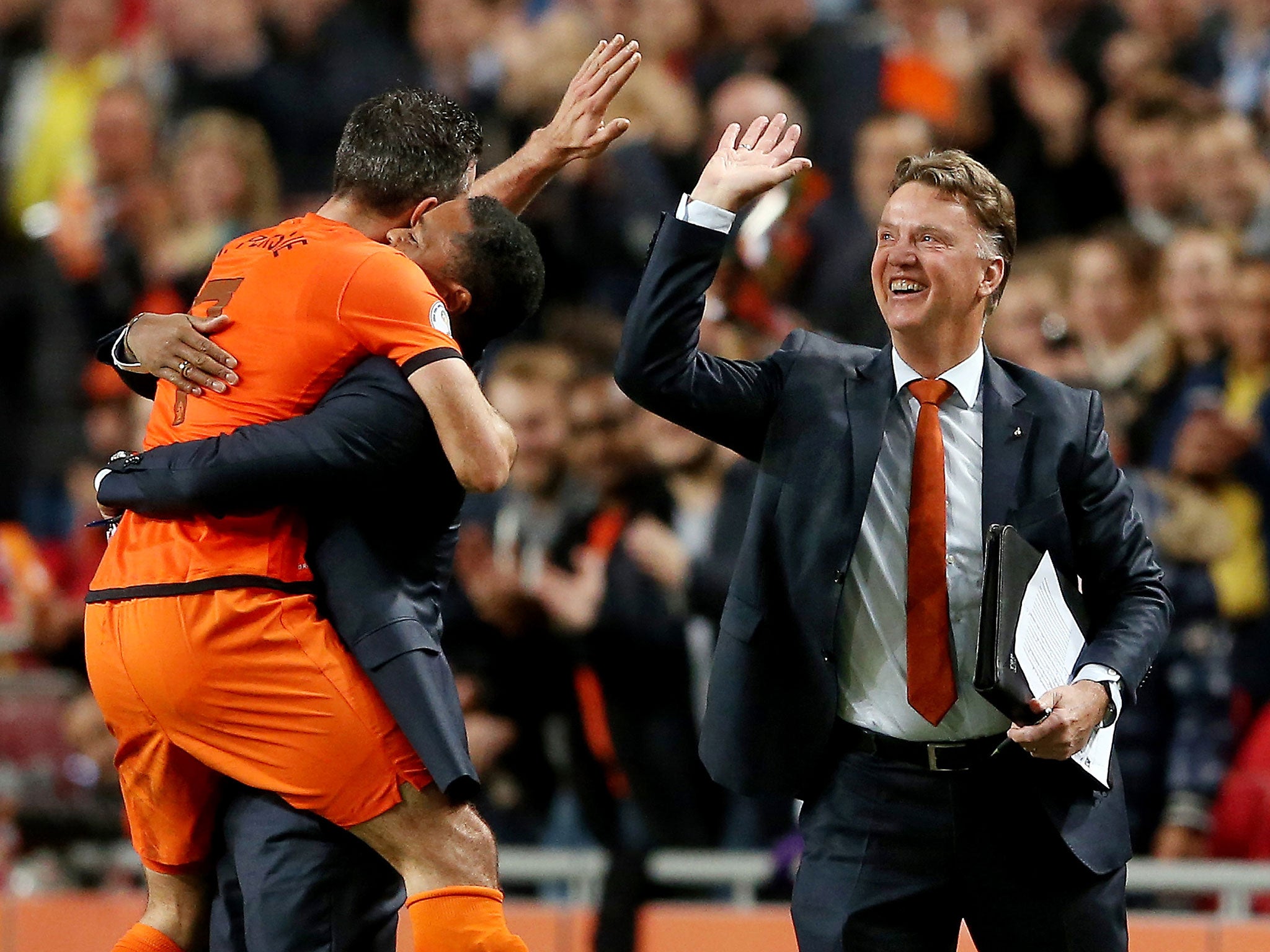 Louis van Gaal (right) celebrates a Netherlands goal with
striker Robin van Persie last year. The pair could be reunited at Old Trafford
