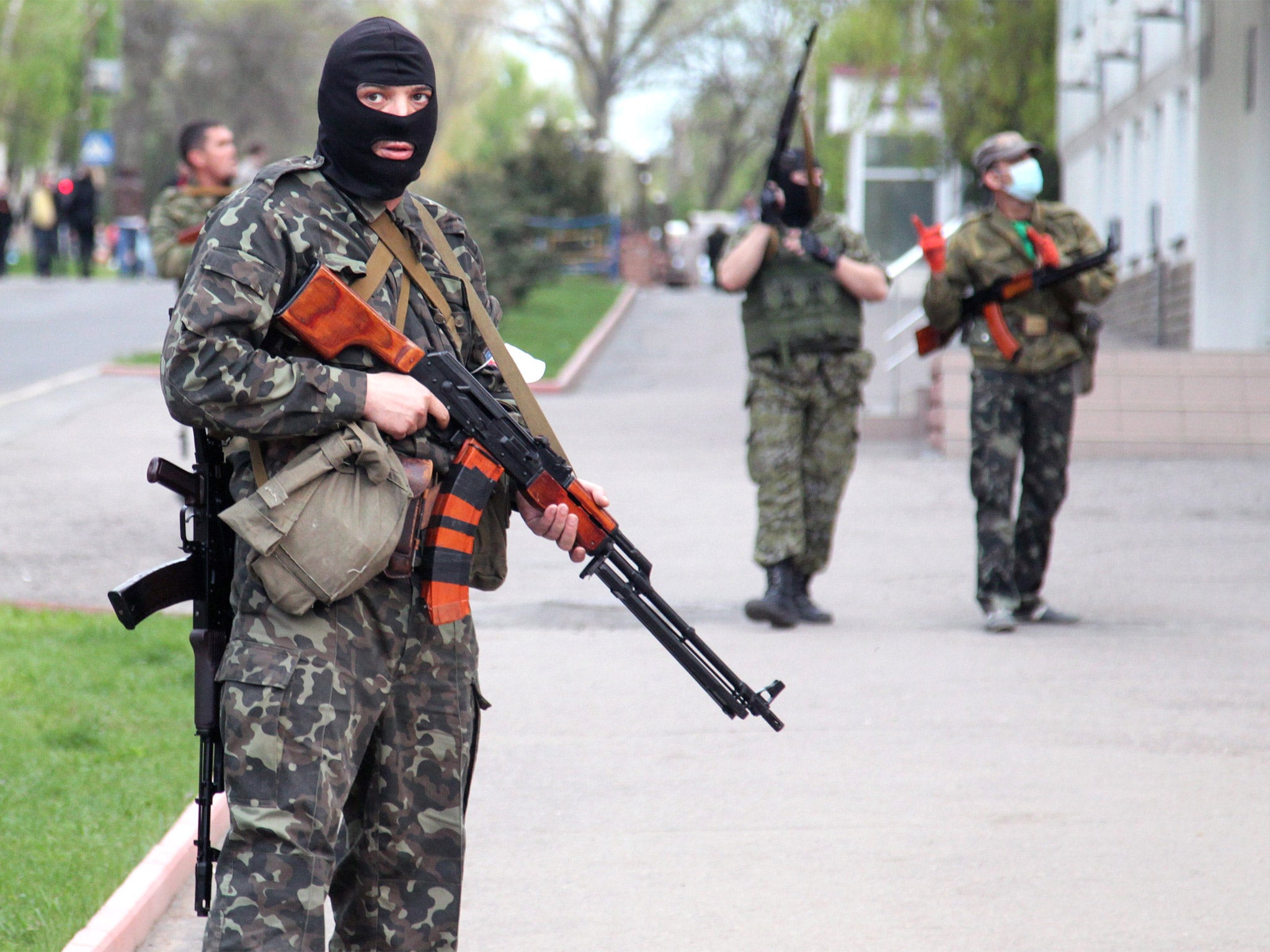 Pro-Russian militants block access to the regional police office in Luhansk