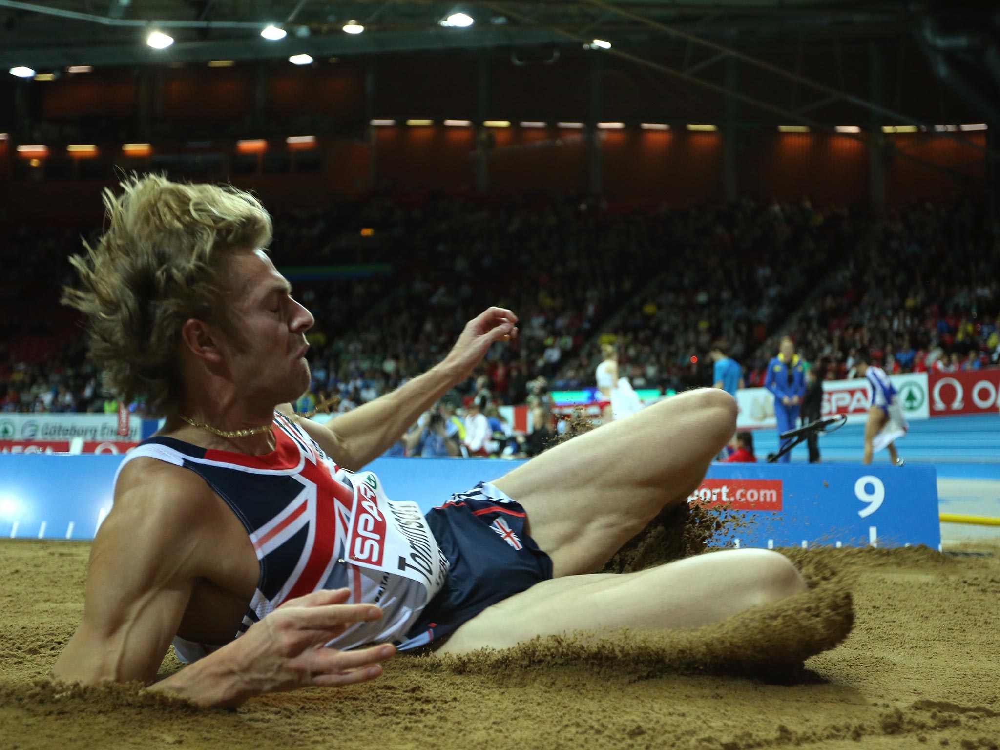Chris Tomlinson has criticised Greg Ruthford's British record jump claiming it as 'illegitimate'