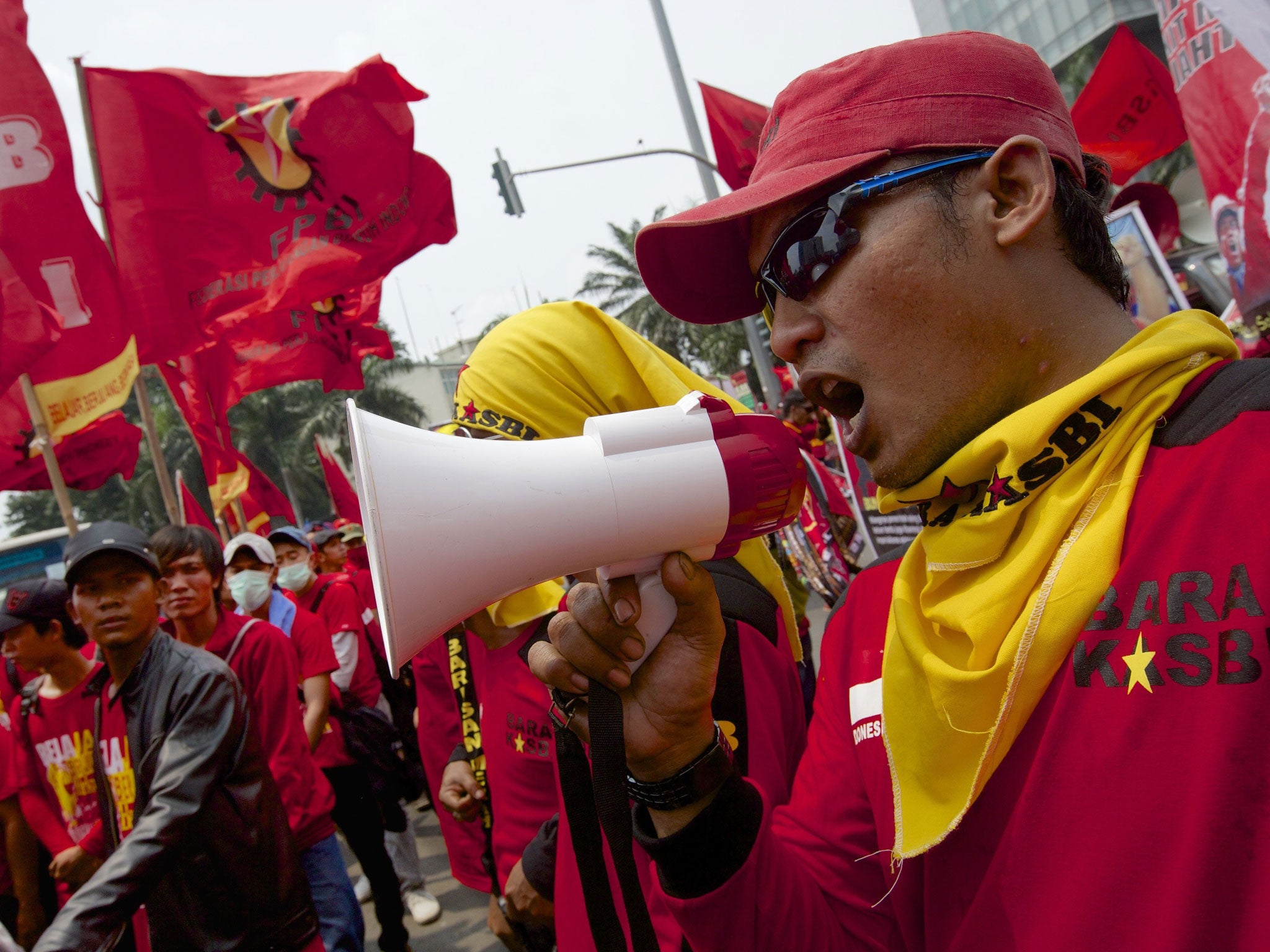 Members of Indonesian Labour unions and labour activists march on May Day in Jakarta in 2014