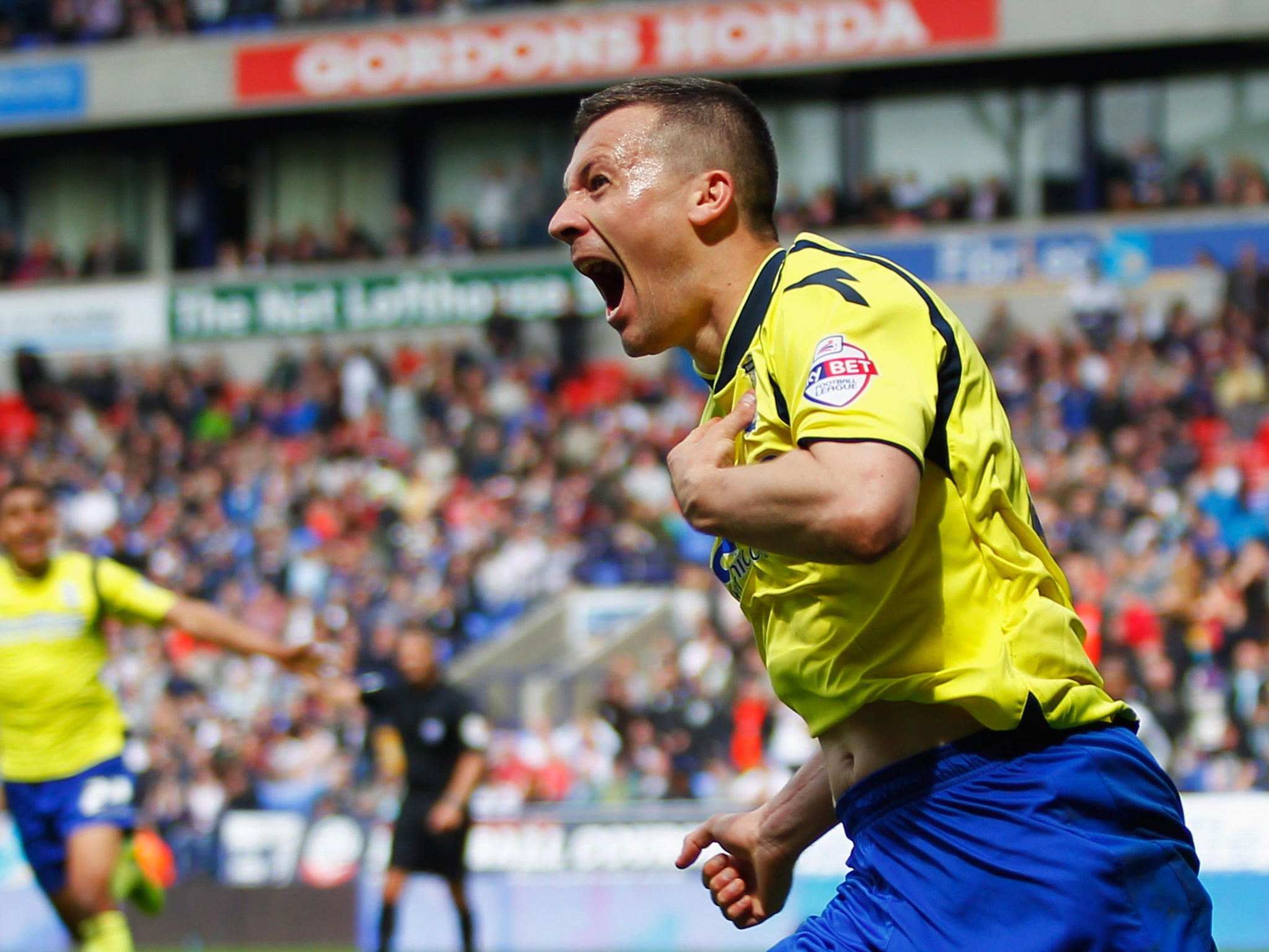 Paul Caddis celebrates scoring an equaliser for Birmingham to keep them in the Championship