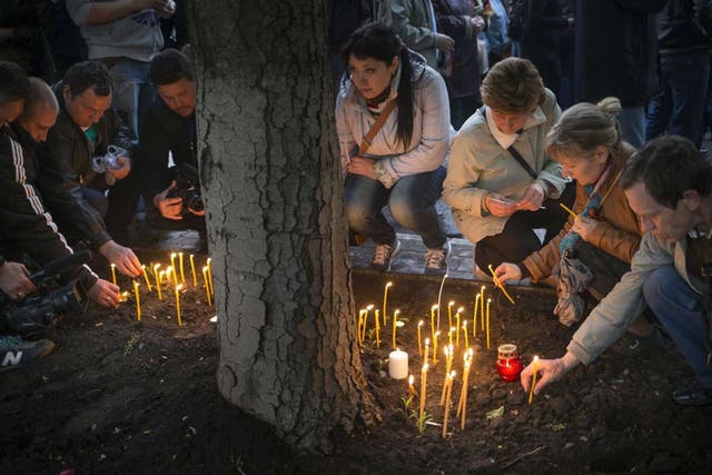 Pro-Russian protesters hold a vigil for dead comrades in Donetsk