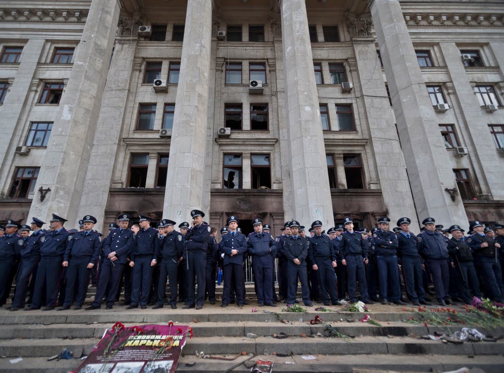 Police troops guard the burnt trade union building in Odessa, where dozens of pro-Russian demonstrators died 