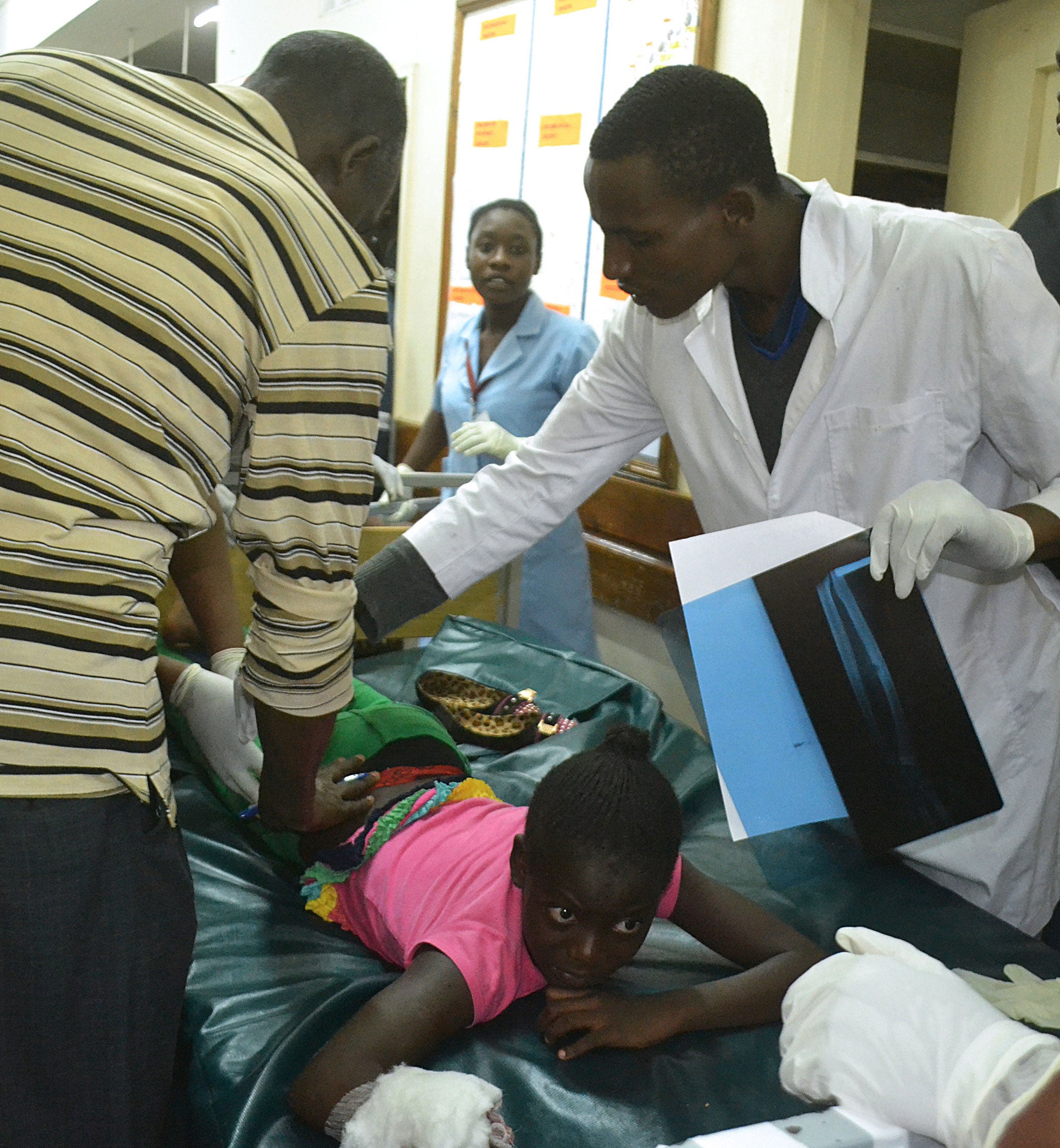 An injured girl receives medical treatment at the Coast general hospital in Mombasa, after sustaining injuries following an explosion in the busy Mwembe Tayari area of the city centre