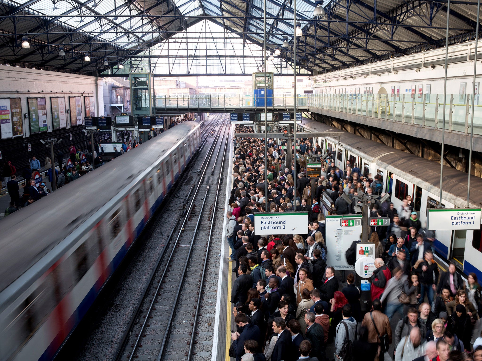Commuters prepare to travel on the District Line of the London Underground which is running a limited service due to industrial action on April 30, 2014 in London, England. At 9pm on April 28, 2014 members of the Rail, Maritime and Transport (RMT) Union c