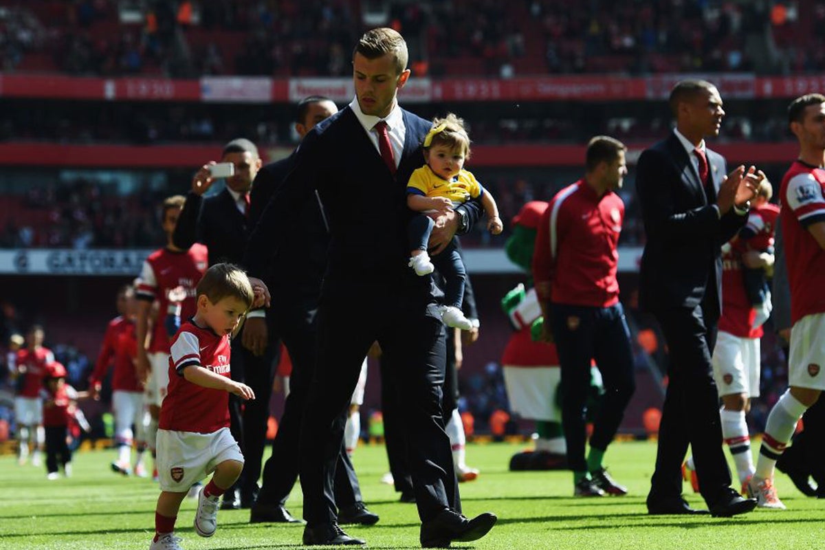 There are some kids on the pitch... Footballers and their offspring ...