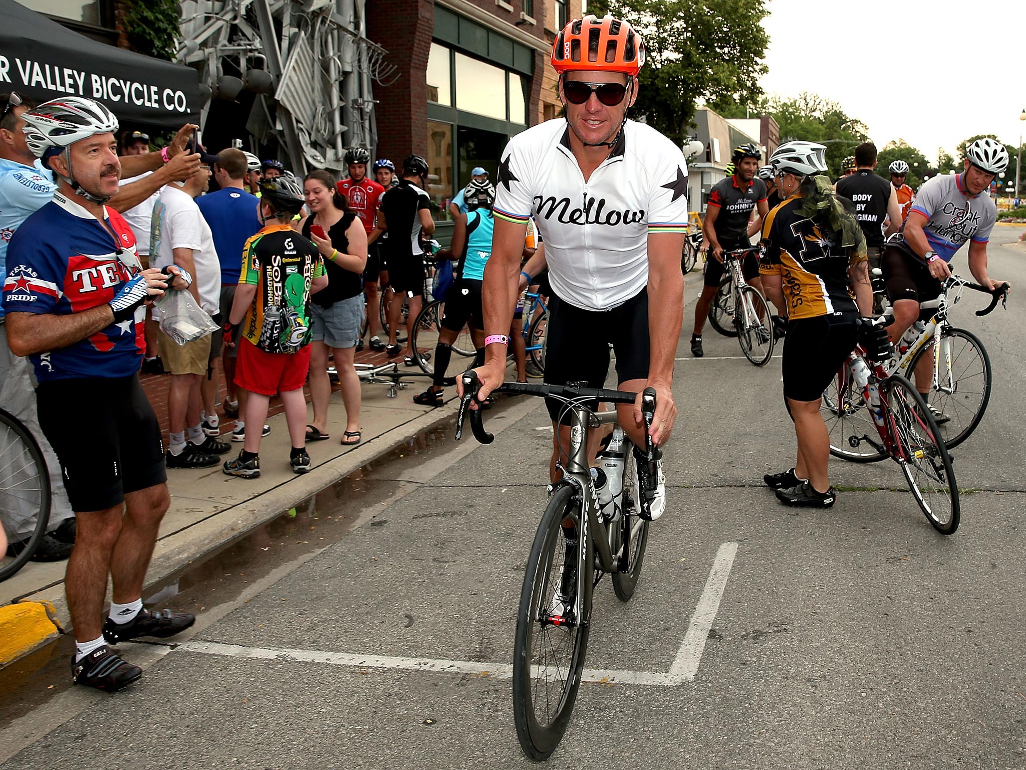 Lance Armstrong departs at the start of the third day of the RAGBRAI en route to West Des Moines on July 23, 2013 in Perry, Iowa