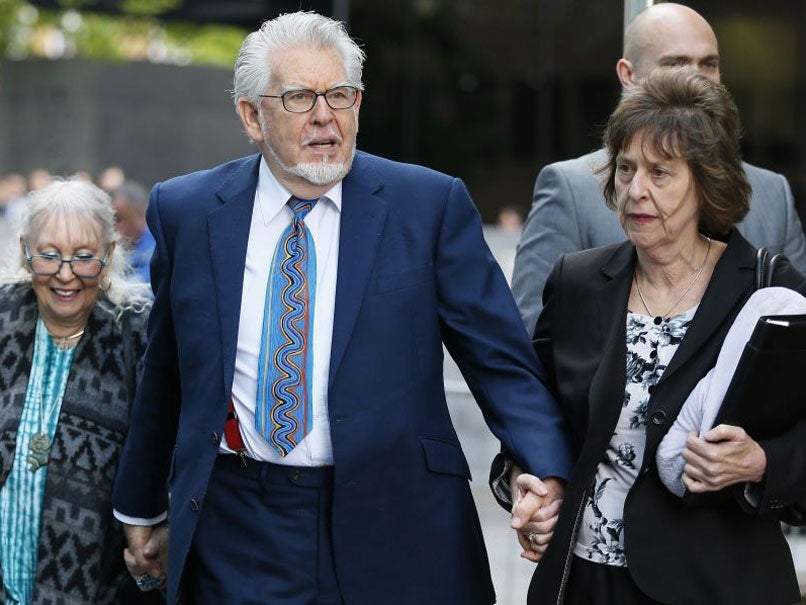 Entertainer Rolf Harris and his wife Alwen Hughes (L) arrive at Southwark Crown Court in central London May 6, 2014.