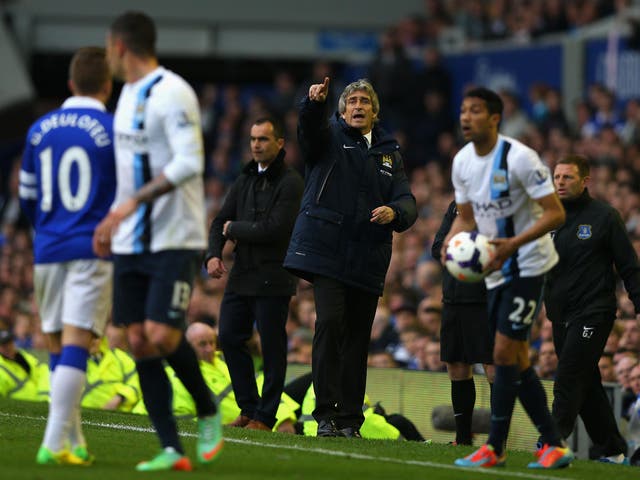 Manchester City Manager Manuel Pellegrini reacts during the Barclays Premier League match between Everton and Manchester City at Goodison Park on May 3, 2014