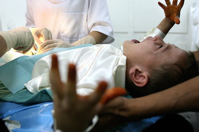 File photo shows a boy screaming during a circumcision at an Algerian hospital 