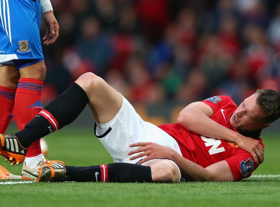 Phil Jones goes down clutching his shoulder in Manchester United's 3-1 win over Hull