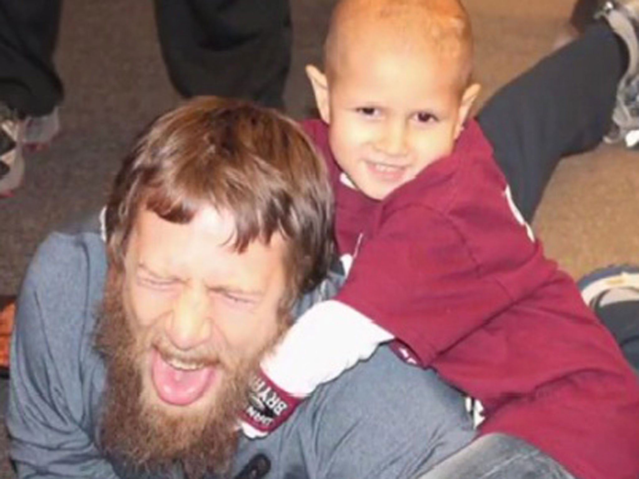 Young Connor (right) performs the Yes! Lock on his hero, the WWE Superstar, Daniel Bryan