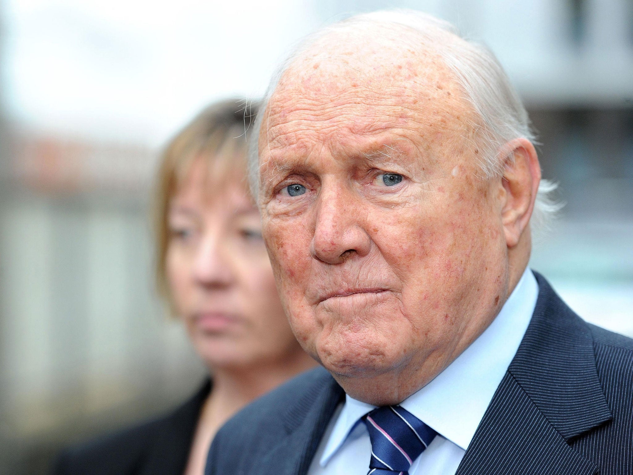 File photo shows Stuart Hall outside Preston Crown Court, where today he faced an ongoing trial into allegations of rape and indecent assault against two young girls