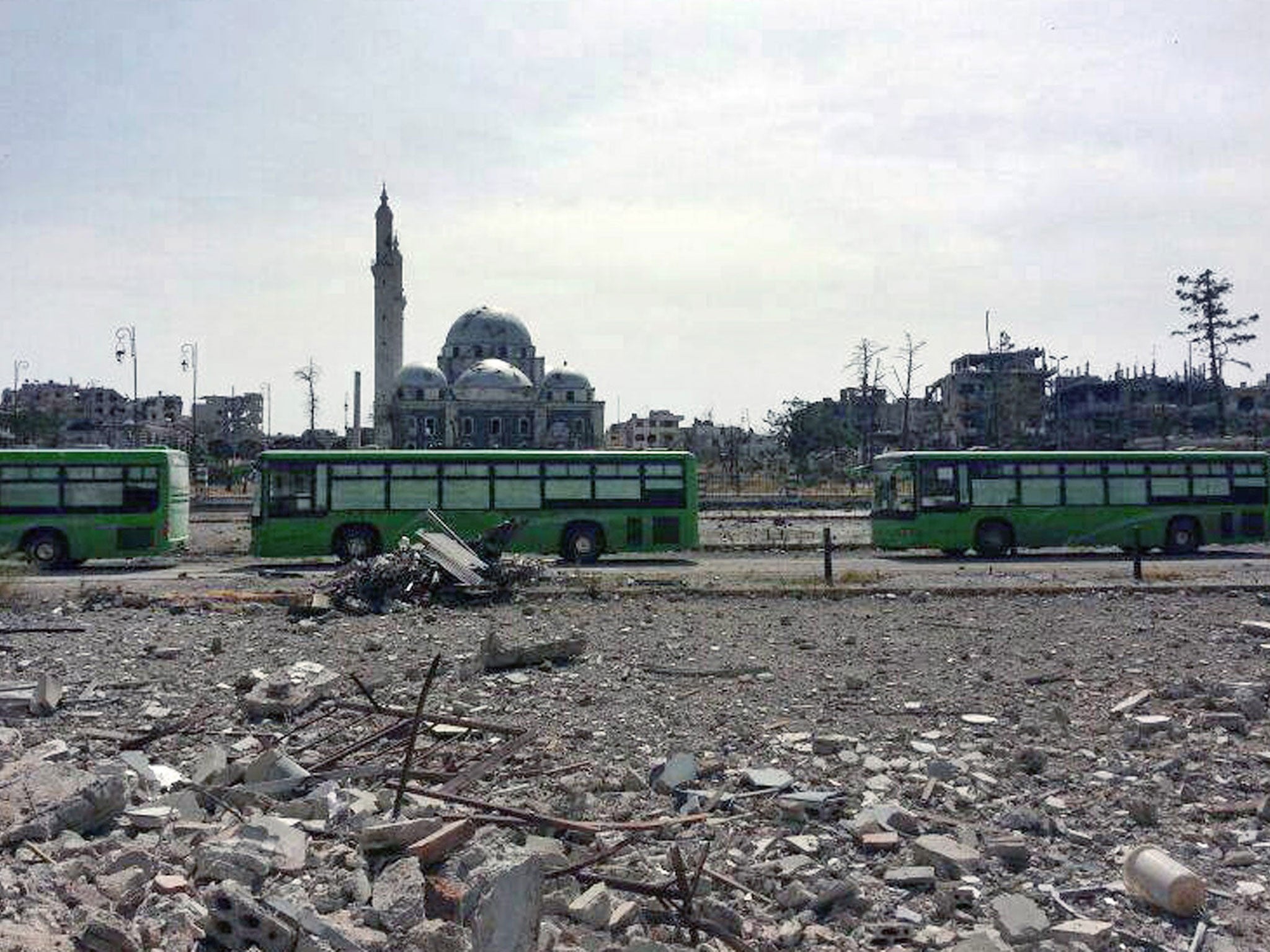 Buses carrying Free Syrian Army fighters leaving Homs