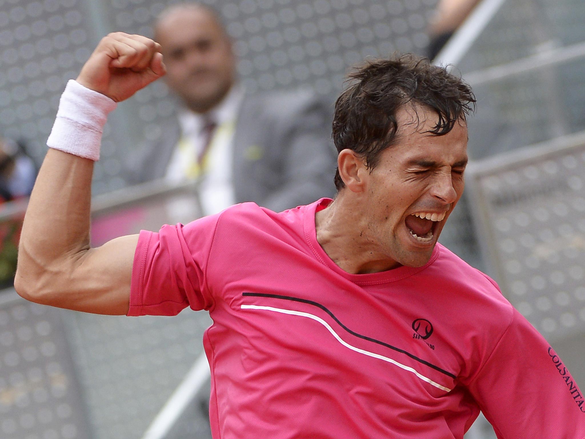 Santiago Giraldo celebrates after beating Andy Murray at the Madrid Masters
yesterday