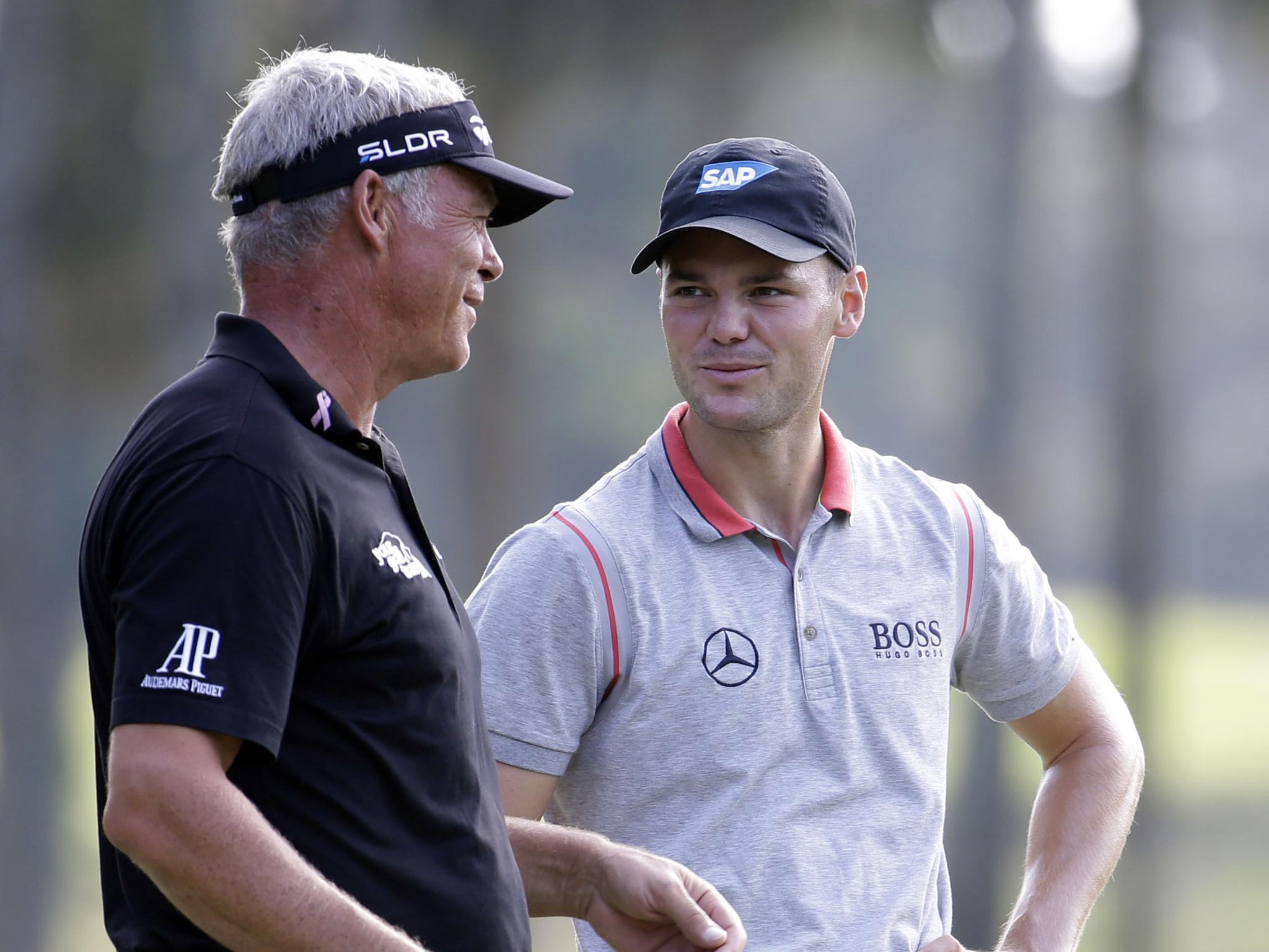 Martin Kaymer (right) hit a second round 69 after a course record equalling 63 in his first to put him 12 under