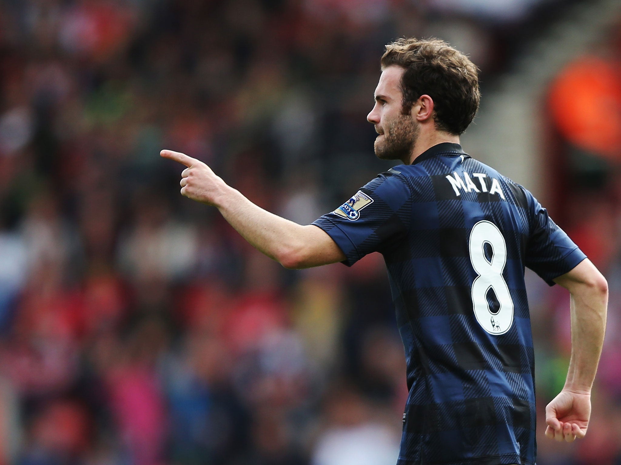 Juan Mata celebrates after putting United level