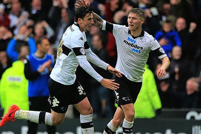 Midfielder George Thorne is congratulated by Jeff Hendrick after scoring Derby County’s third goal