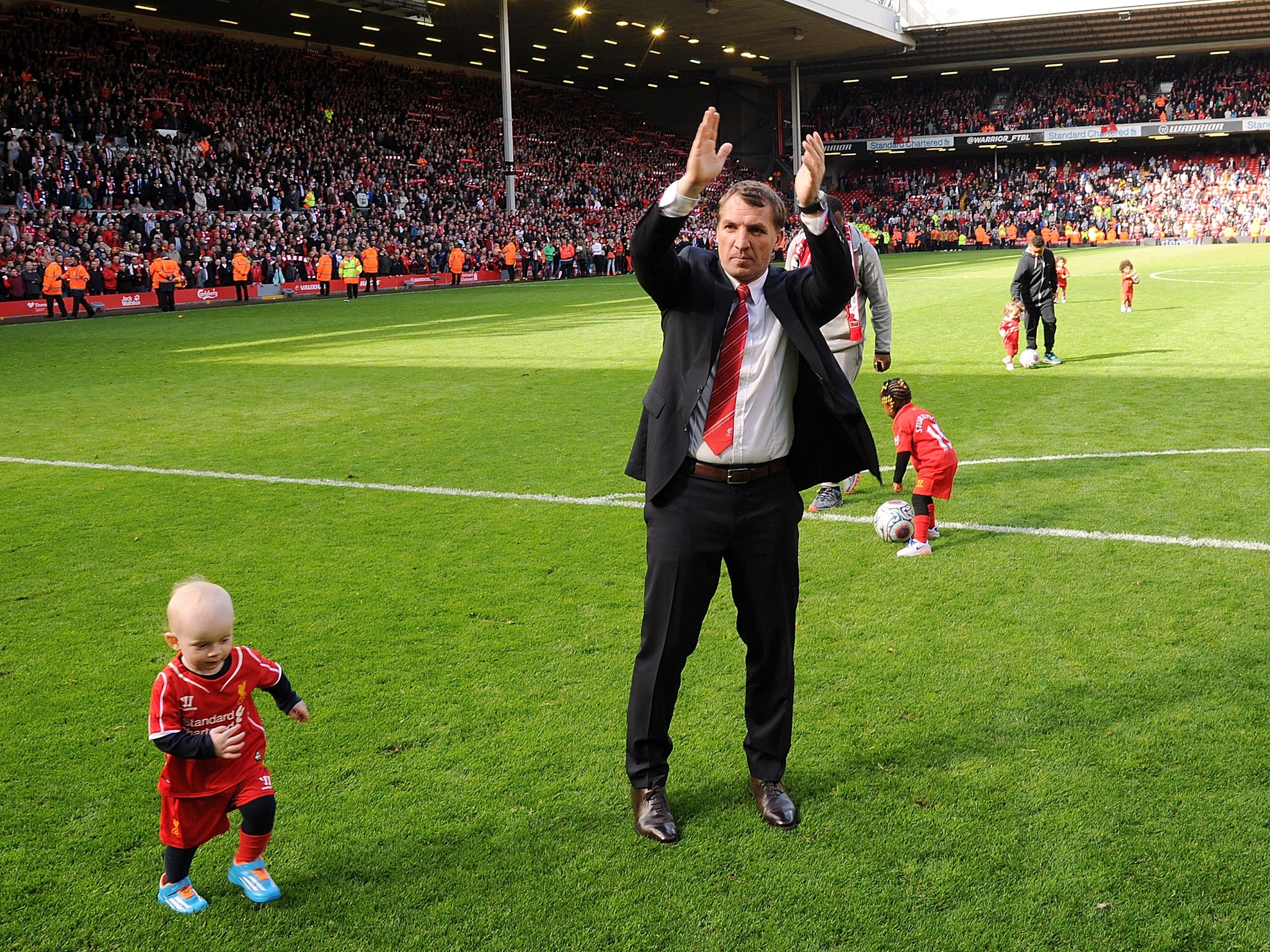 Brendan Rodgers applauds the Liverpool fans for their support this season after the 2-1 win over Newcastle