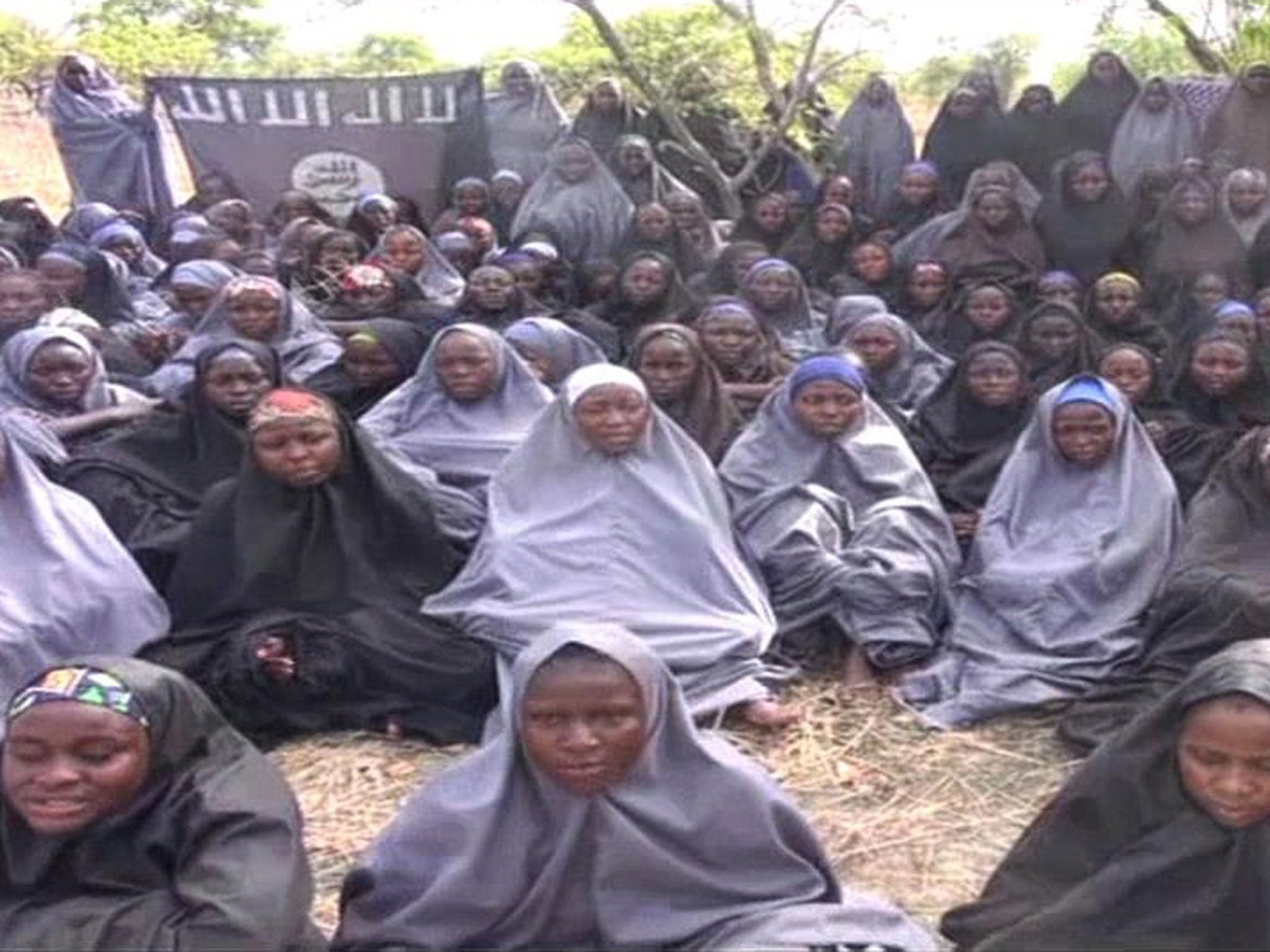 A screengrab taken on May 12, 2014, from a video of Nigerian Islamist extremist group Boko Haram obtained by AFP shows girls, wearing the full-length hijab and praying in an undisclosed rural location