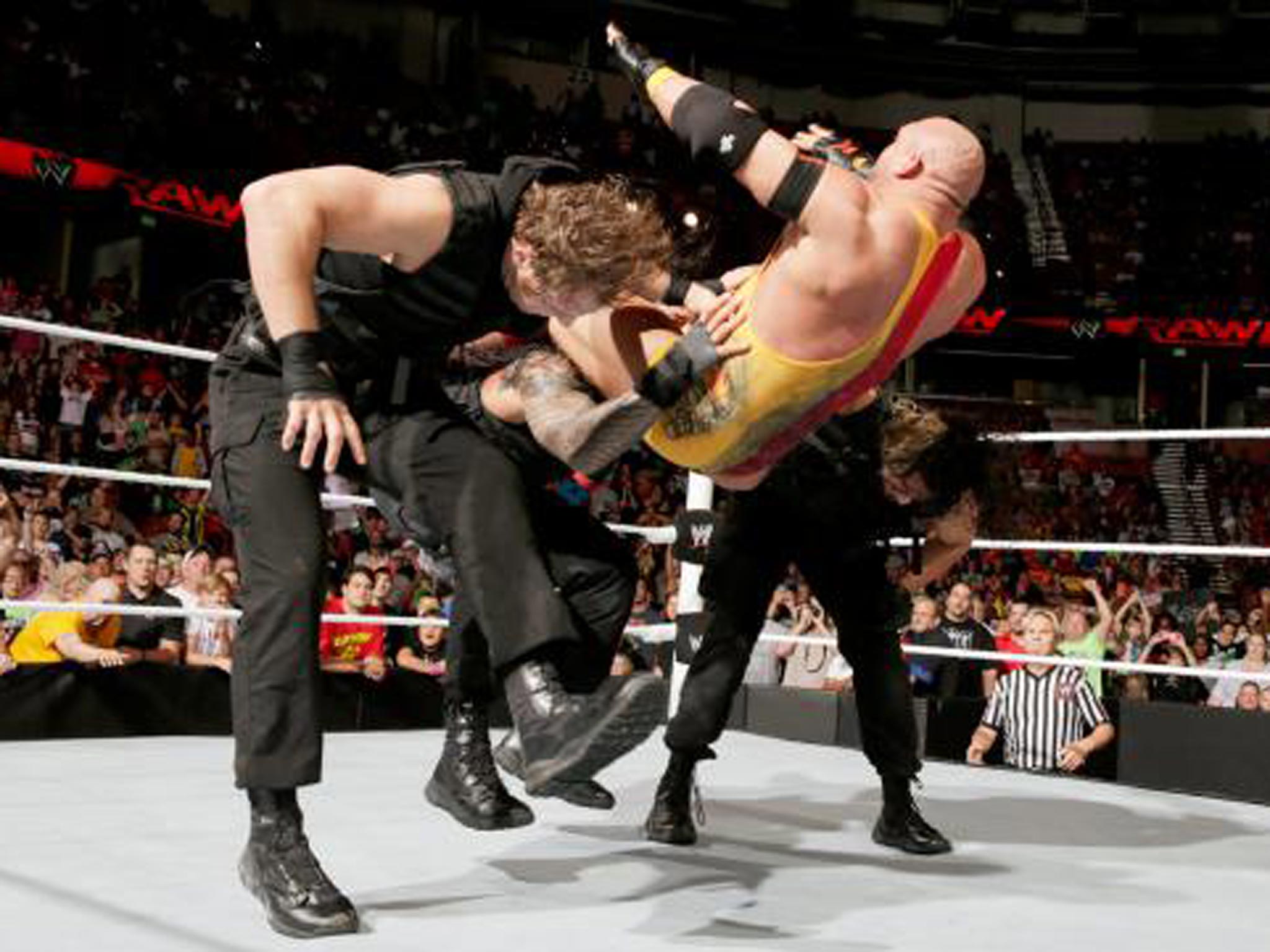 The Shield deliver a triple powerbomb to Ryback to send a message to Evolution