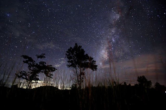This long-exposure photograph taken on August 12, 2013 shows the Milky Way in the clear night sky near Yangon. The Perseid meteor shower occurs every year in August when the Earth passes through the debris and dust of the Swift-Tuttle comet. 