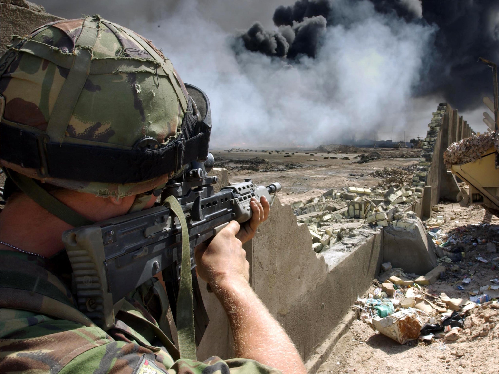 A British soldier takes aim in Basra, Iraq