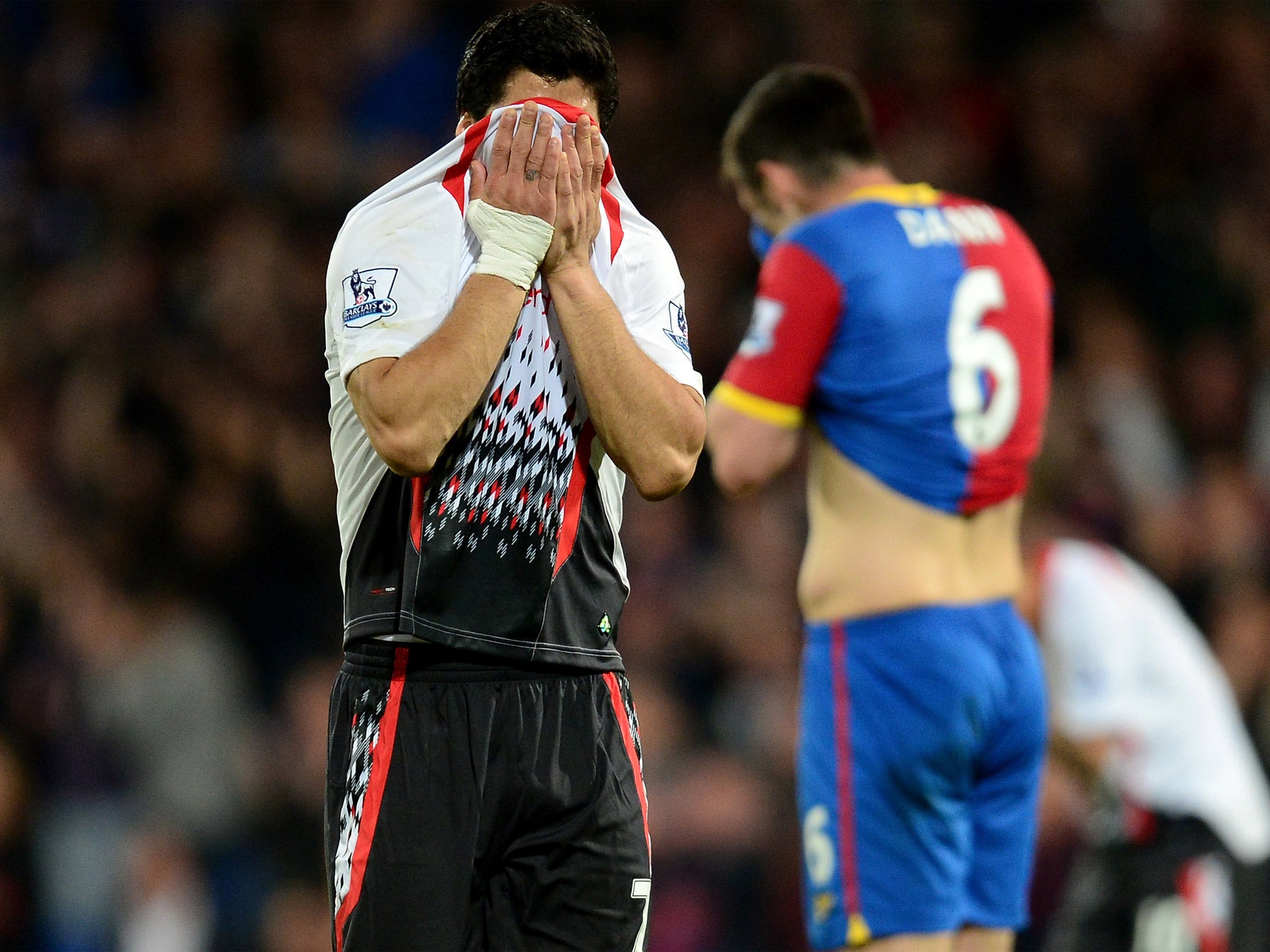 Luis Suarez hides his face at Crystal Palace after Liverpool’s 3-3 draw