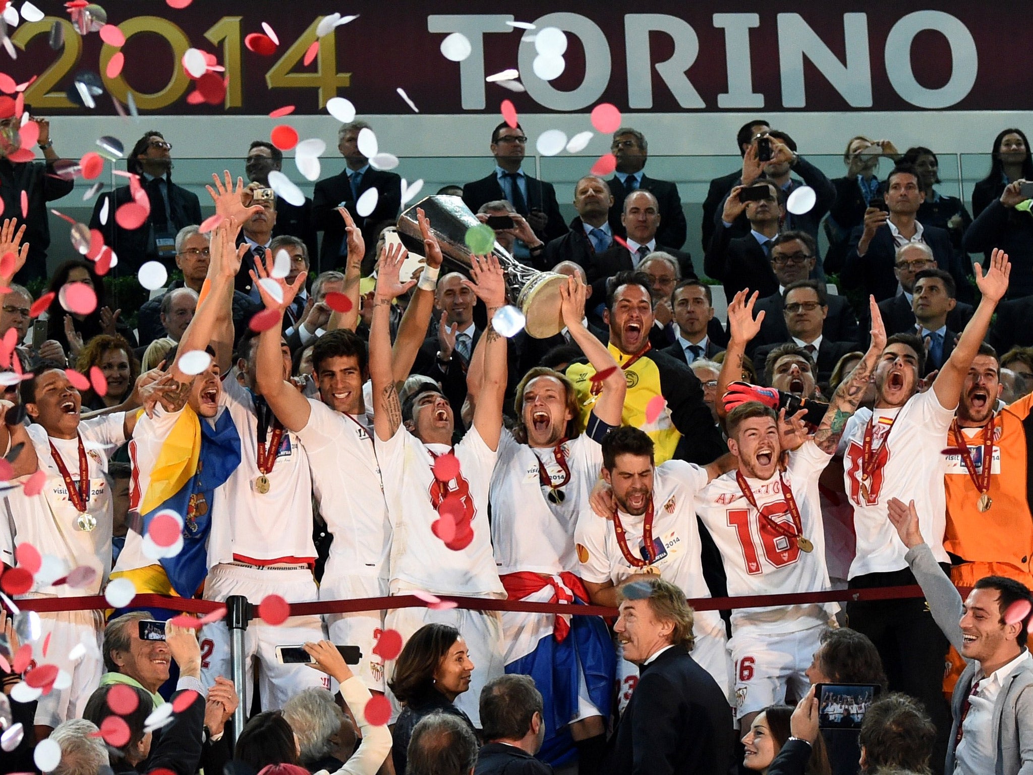 Ivan Rakitic raises the Europa league trophy as Sevilla are crowned champions