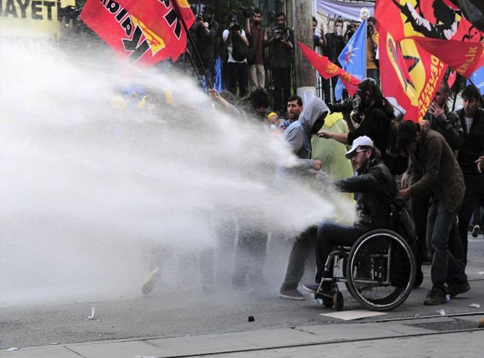Riot police use water cannon to disperse protesters during a demonstration blaming the ruling AK Party (AKP) government for the mining disaster in western Turkey