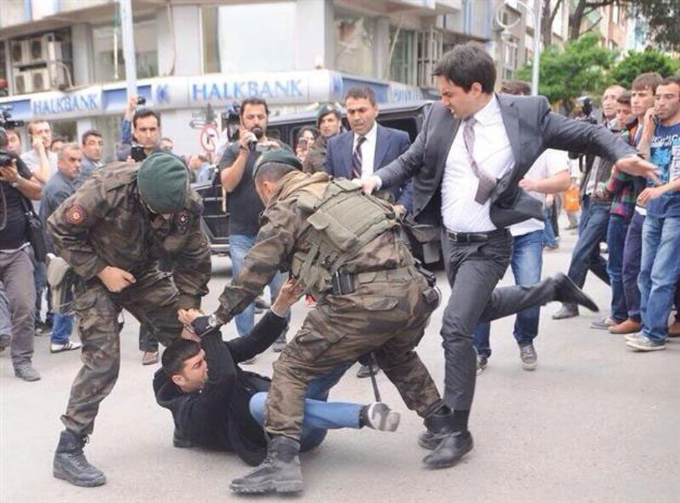 The moment the PM's aide Yusuf Yerkel was allegedly caught kicking a protester  