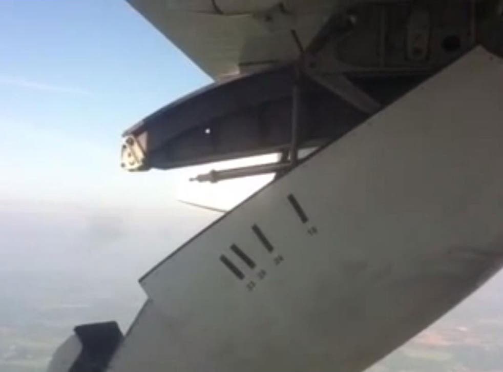 A still from footage of the City Jet flight showing the moment cover of the operating mechanism on the wing became partially detached