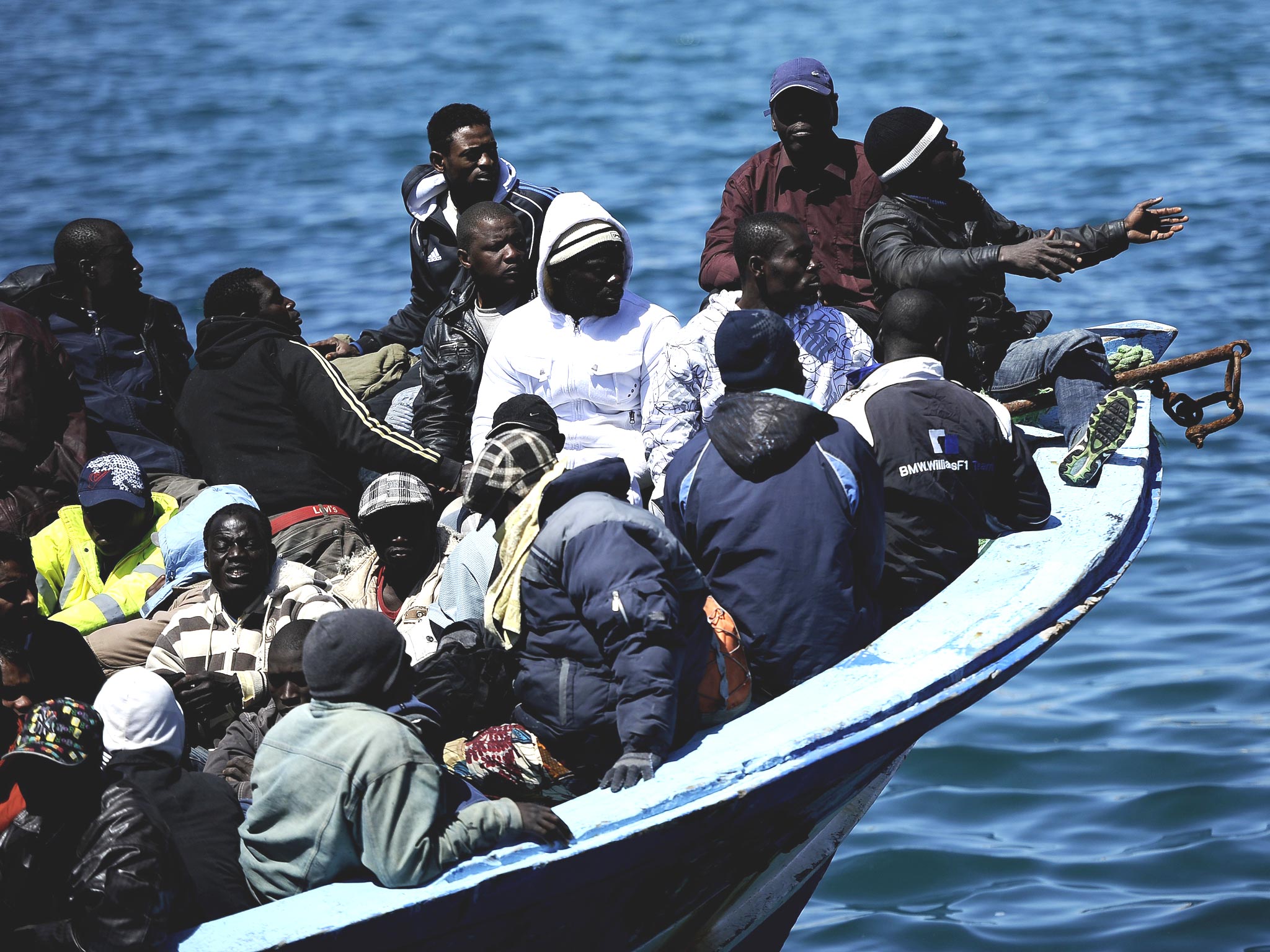 A boat with more 200 people aboard arrives from Libya on the Italian island of Lampedusa back in 2011
