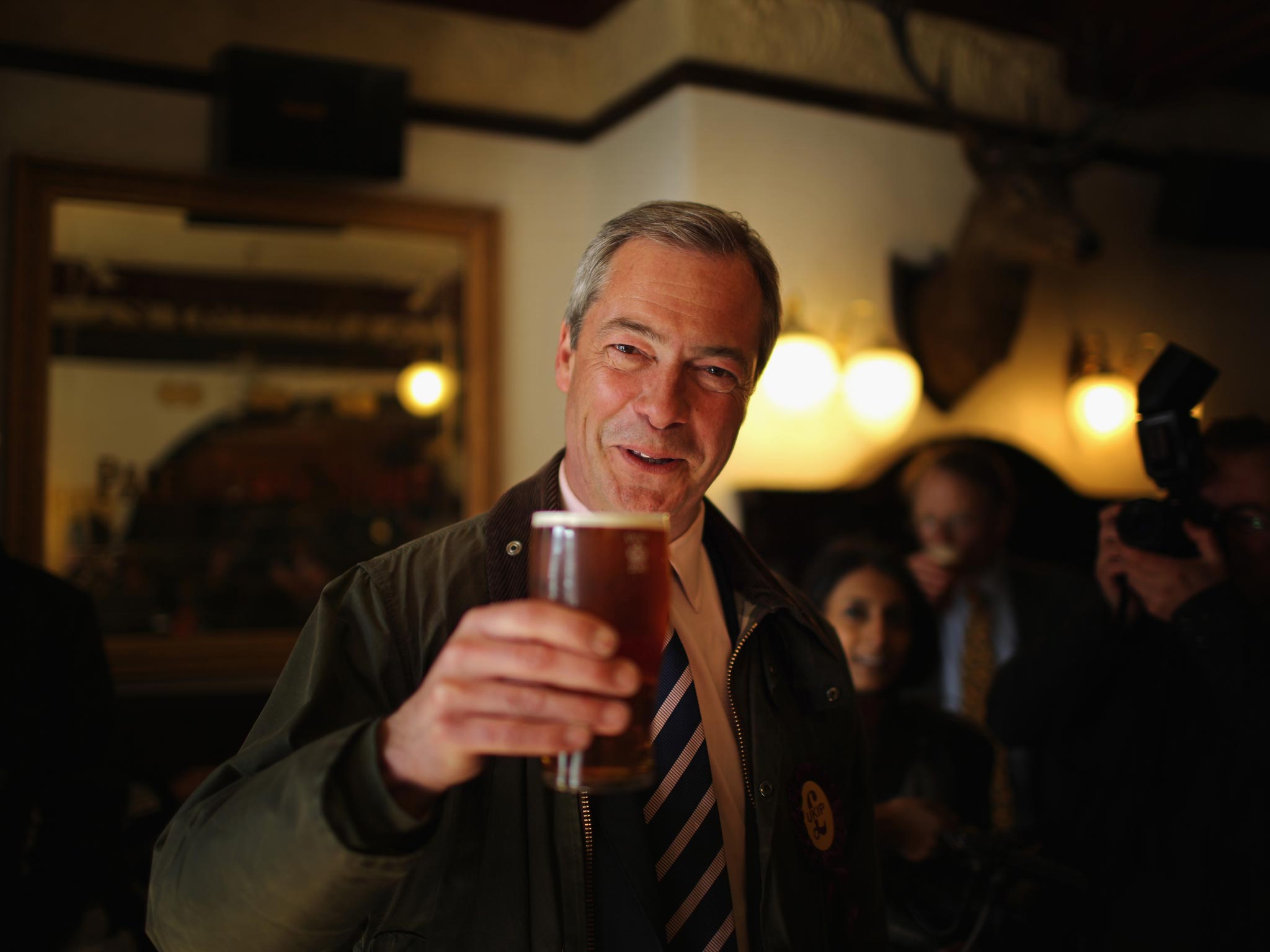 File: Nigel Farage with a pint