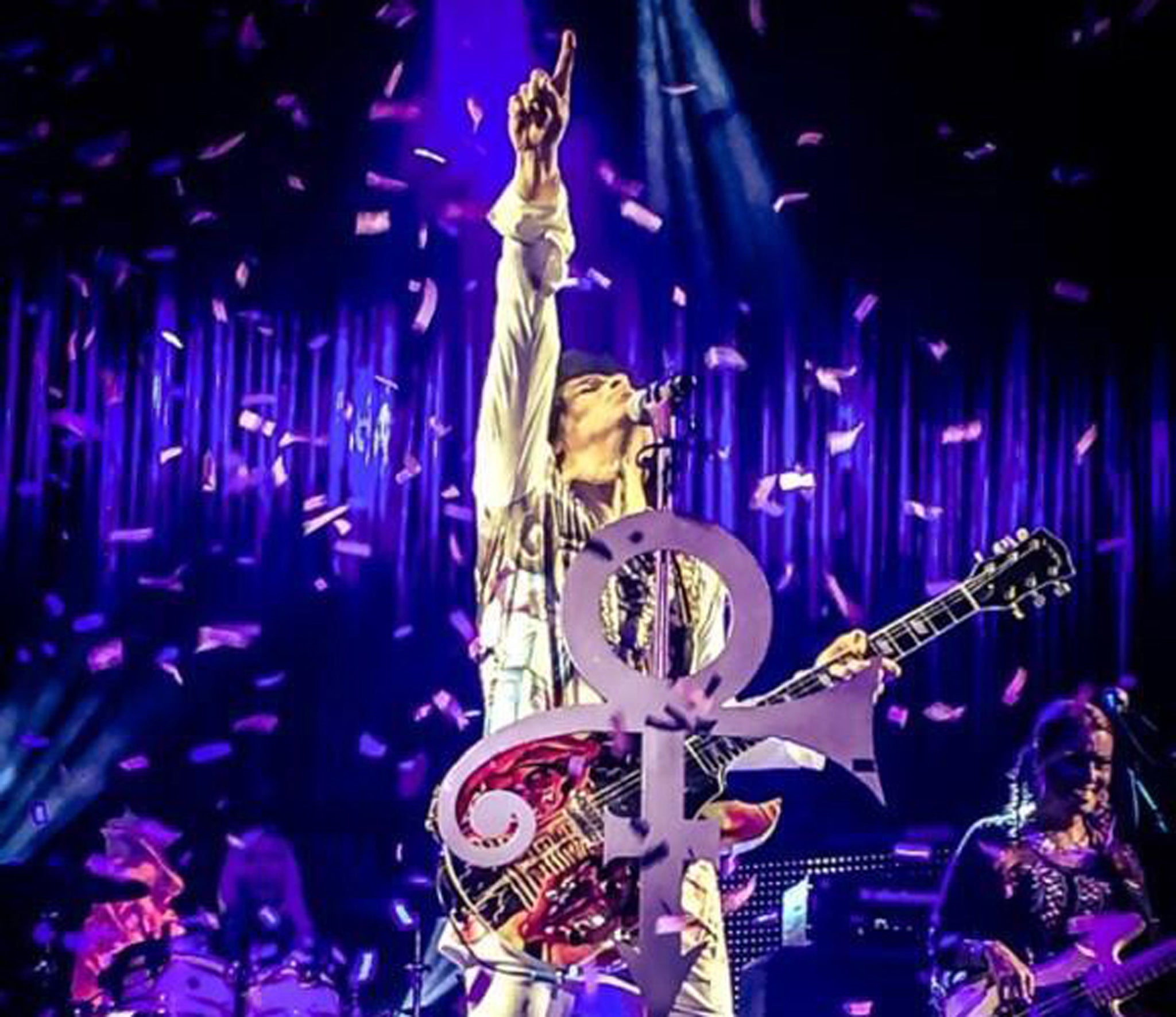 Prince performs on stage in Birmingham as part of his UK tour