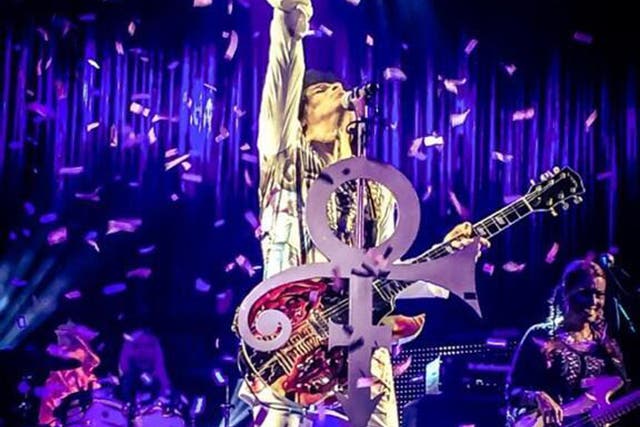 Prince performs on stage in Birmingham as part of his UK tour