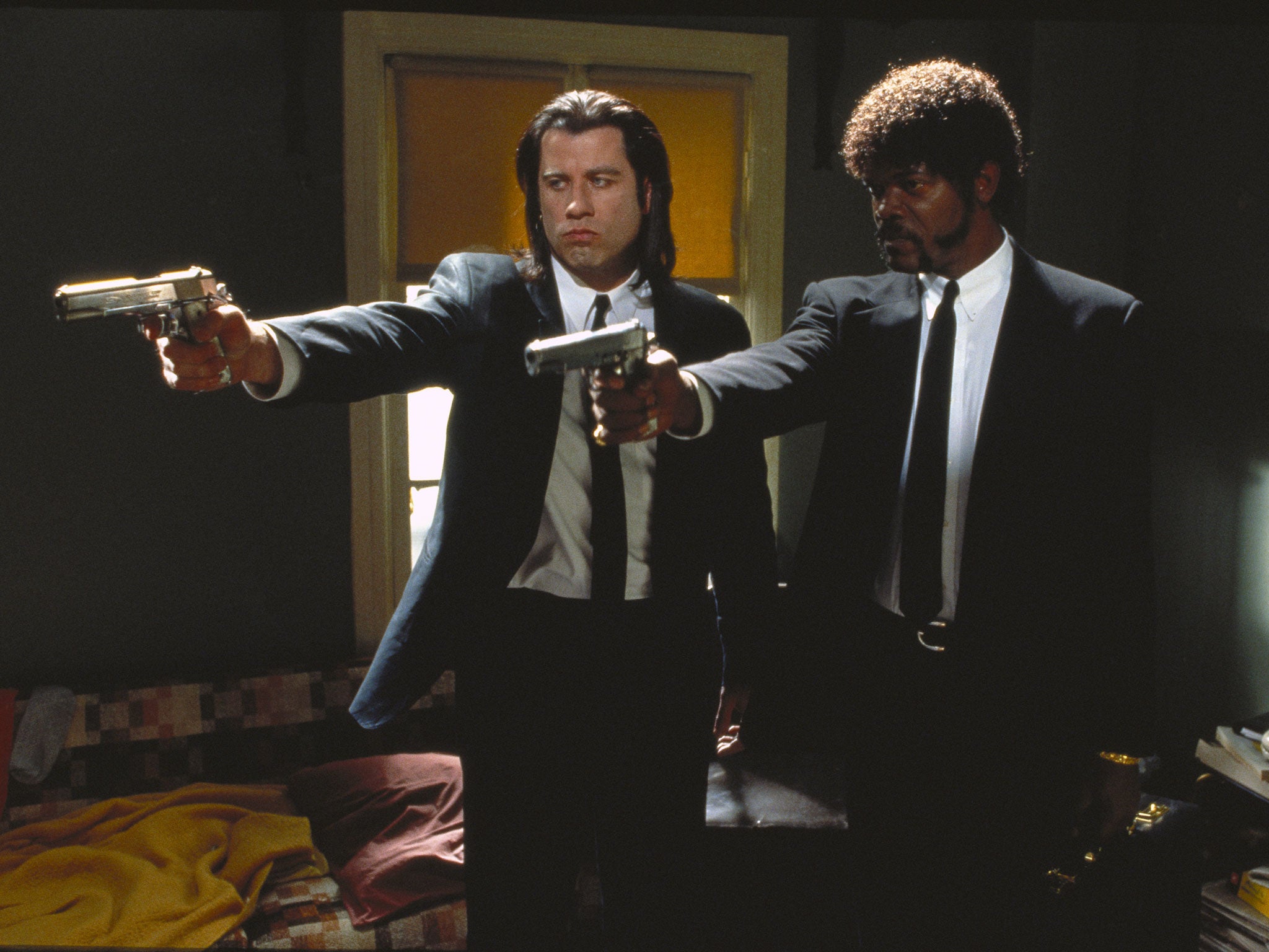 John Travolta as Vincent Vega and Samuel L Jackson as Jules Winnfield in Quentin Tarantino’s 1994 Palme d’Or winner, Pulp Fiction