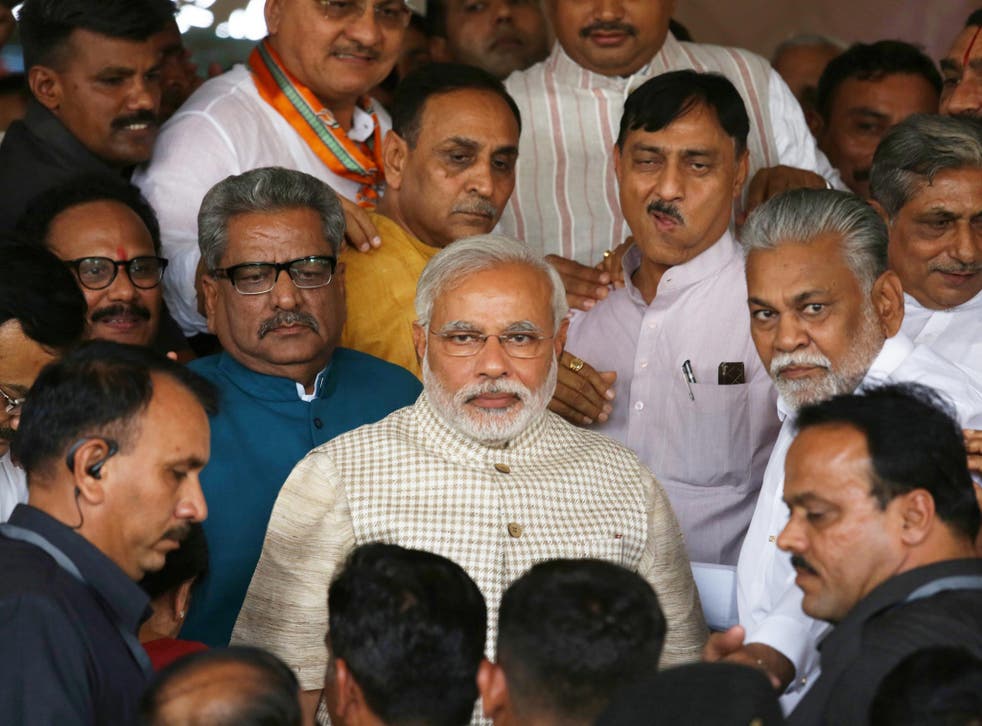 India’s new Prime Minister Narendra Modi (centre), with his supporters yesterday at the BJP’s Gujarat headquarters in Gandhinagar, is the first Indian leader to have been born after independence in 1947