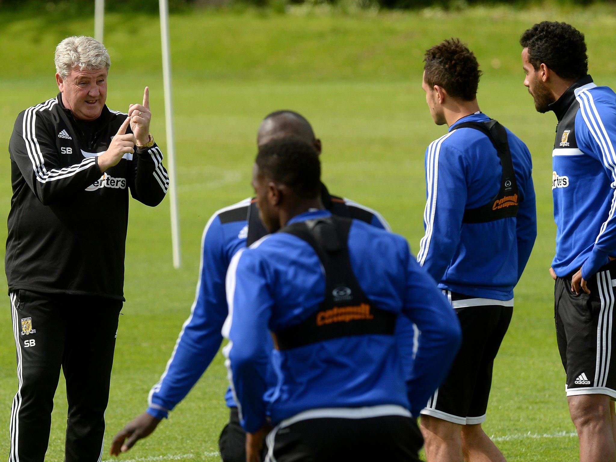Steve Bruce discusses tactics with his players during a training session this week