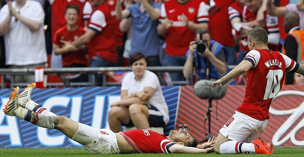 Ram raid: Aaron Ramsey wins the FA Cup final for Arsenal and ends a nine-year wait for silverware with a snatched strike in extra-time as the Gunners edged past Hull City 3-2 in a thriller at Wembley