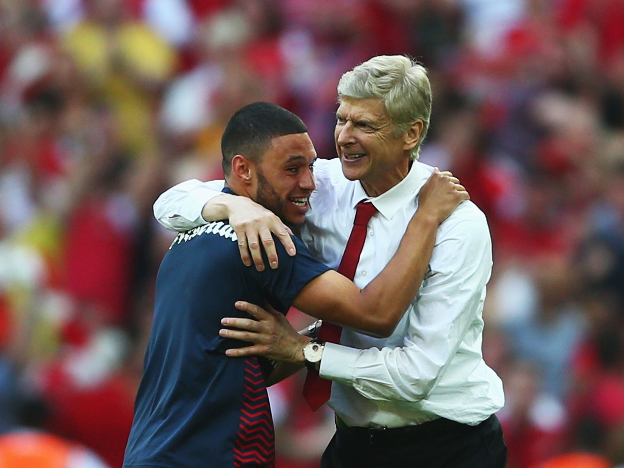 Arsene Wenger embraces Alex Oxlade-Chamberlain after the FA Cup victory