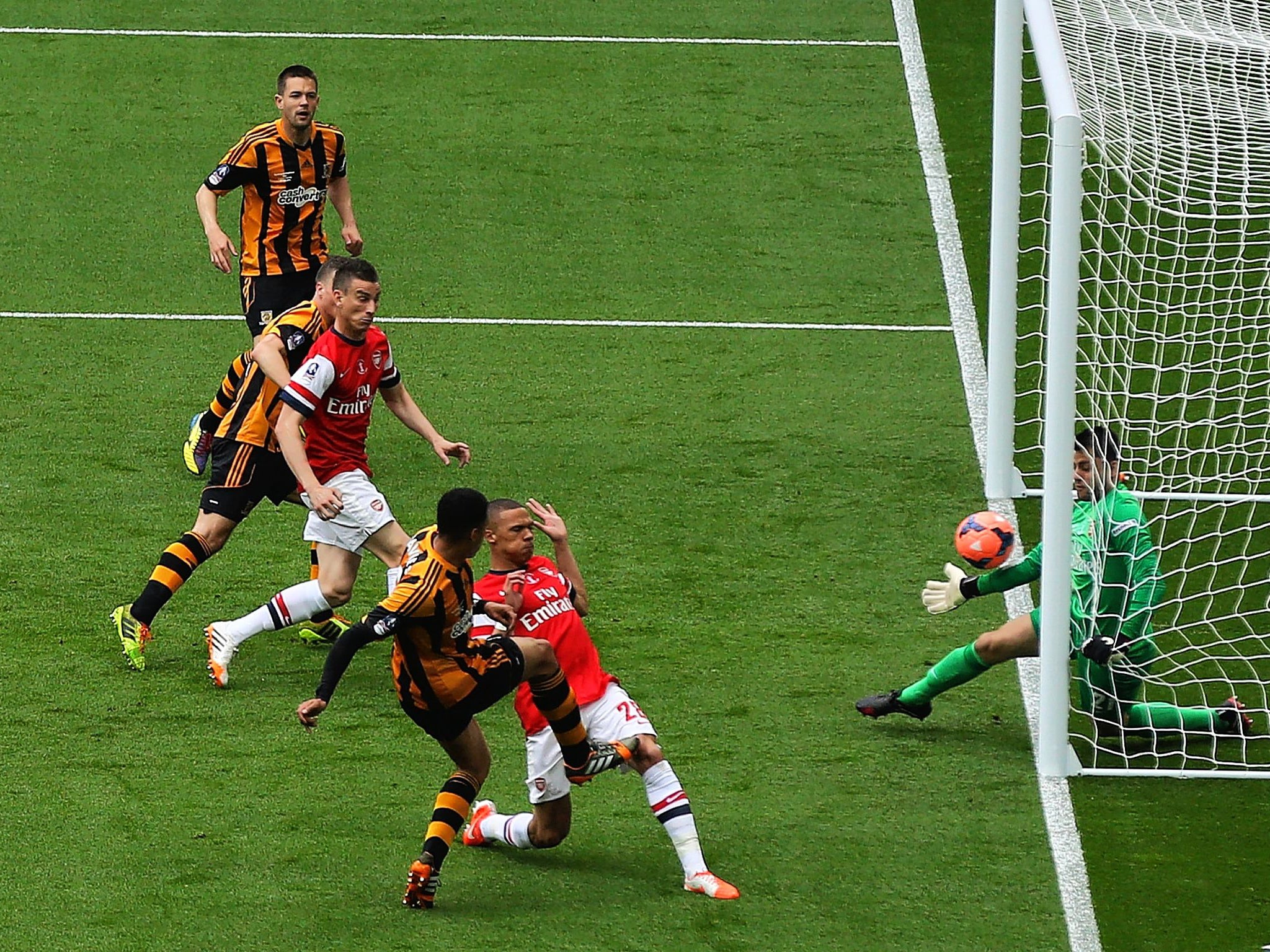 Curtis Davies scores Hull’s second goal to make it 2-0 after eight minutes, much to the consternation of Arsène Wenger