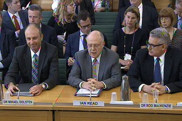 Pfizer chief Ian Read, centre, flanked by his colleagues Mikael Dolsten, left, and Rod MacKenzie, right, face the Science and Technology Committee at the House of Commons