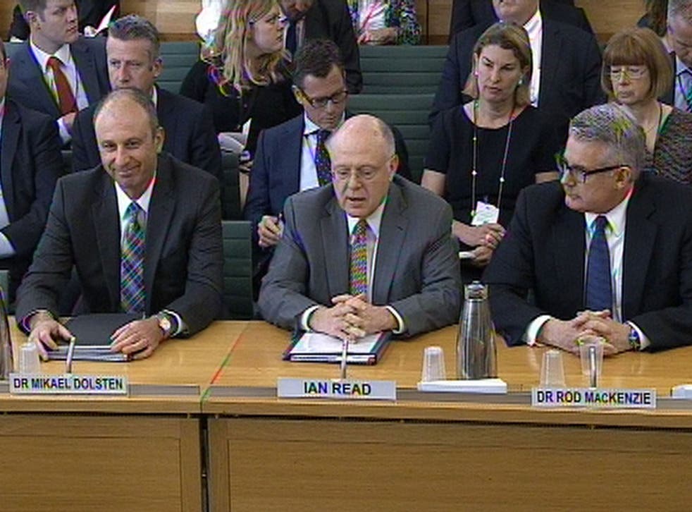 Pfizer chief Ian Read, centre, flanked by his colleagues Mikael Dolsten, left, and Rod MacKenzie, right, face the Science and Technology Committee at the House of Commons