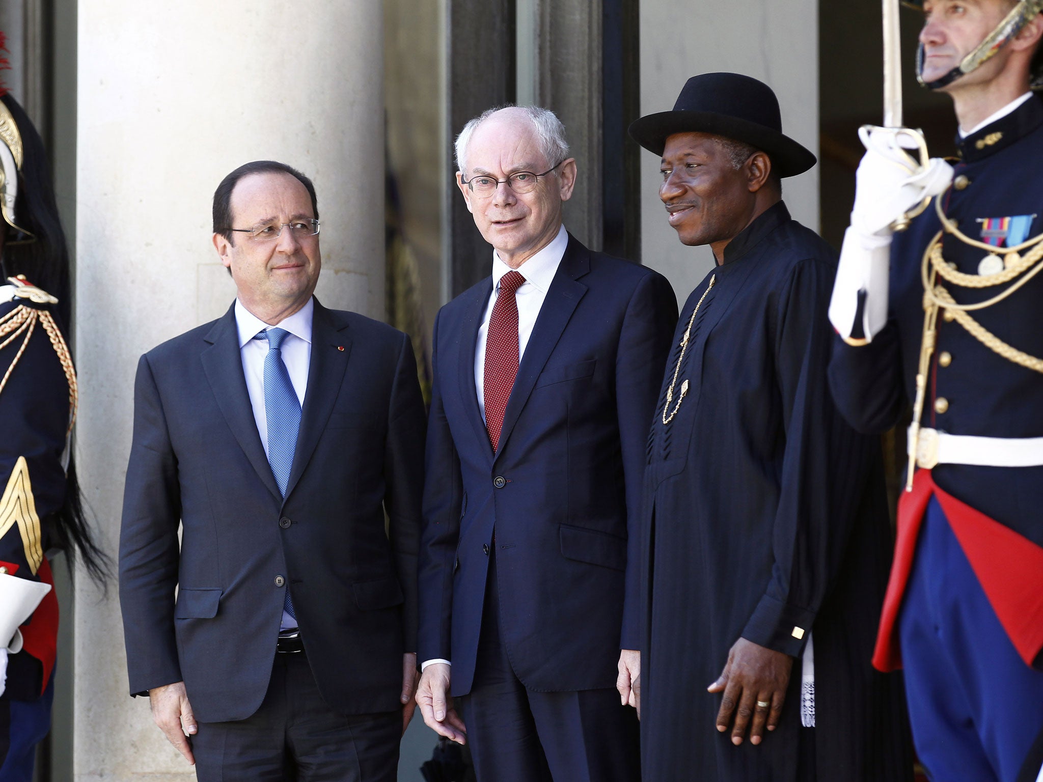 François Hollande, left, and Goodluck Jonathan, right