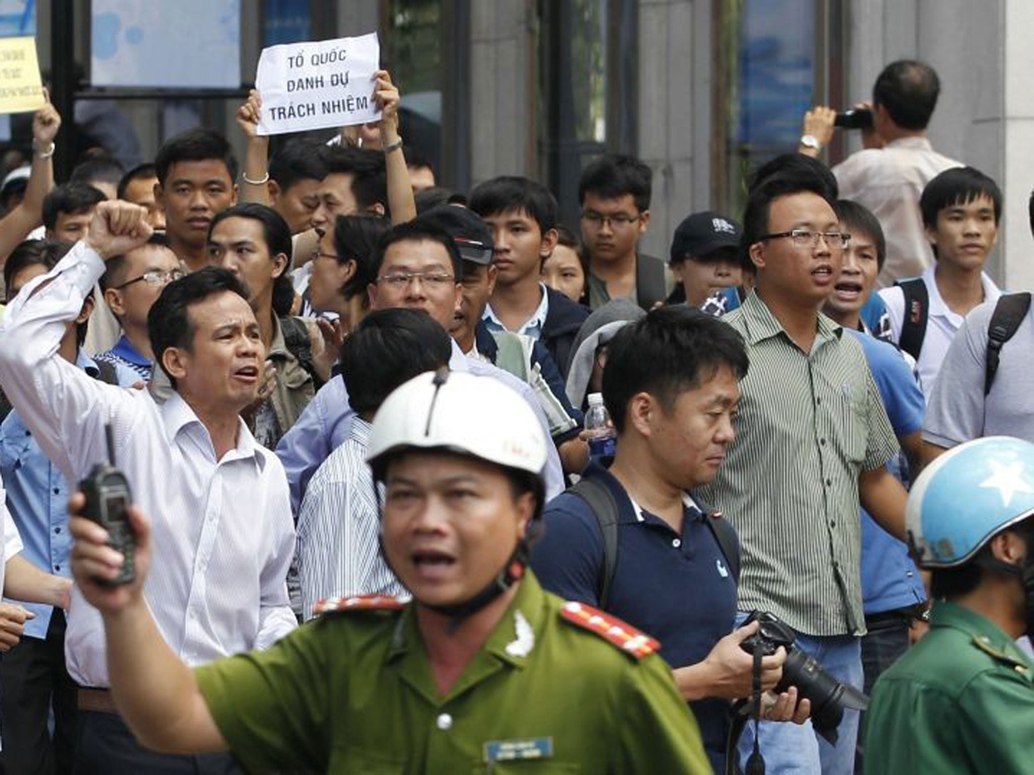 Protesters chant anti-China slogans as they march during an anti-China protest in Vietnam's southern Ho Chi Minh city on 18 May, 2014