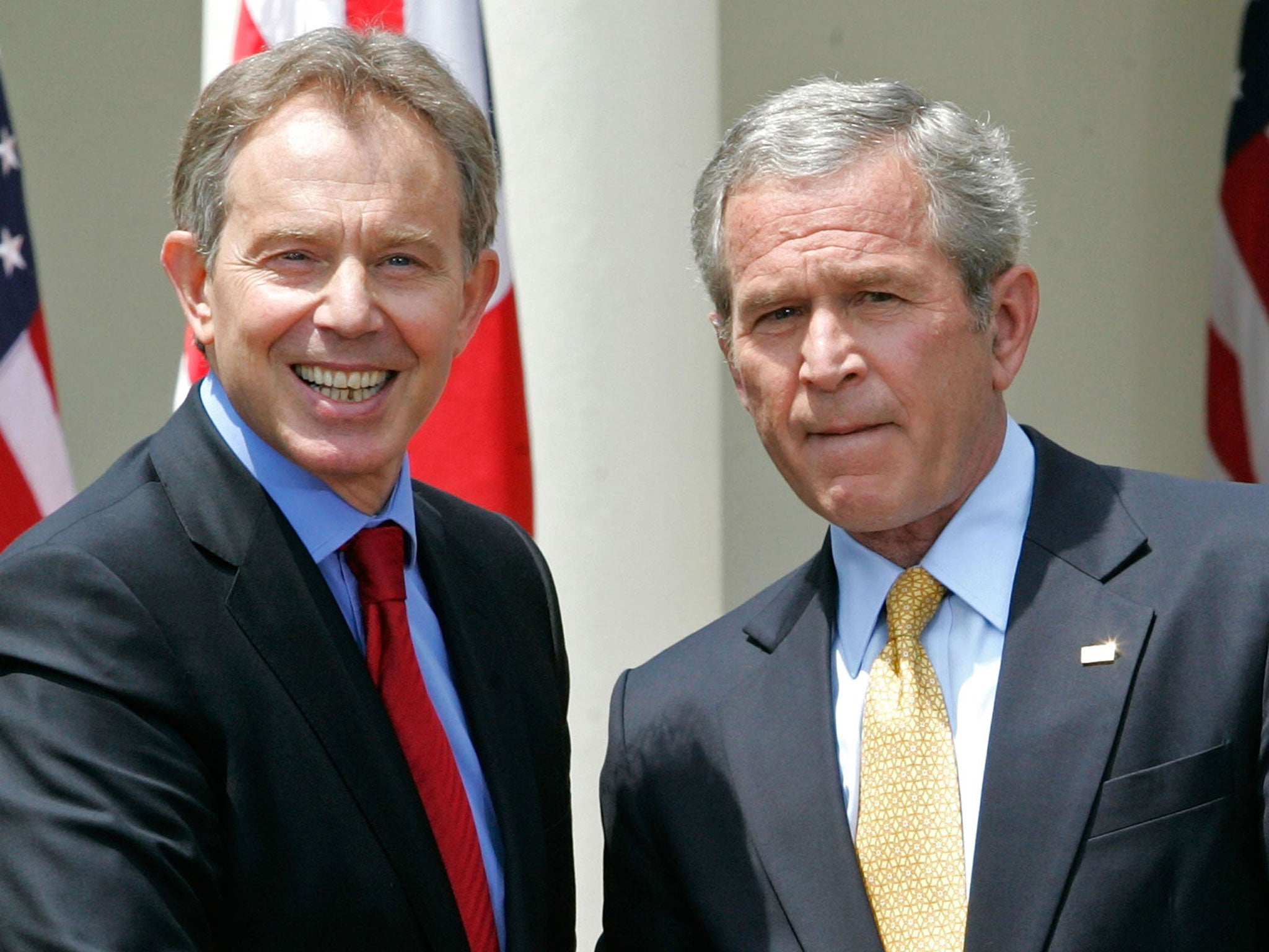 Tony Blair and US President George W Bush shake hands after a news conference in the Rose Garden of the White House in Washington, 2007